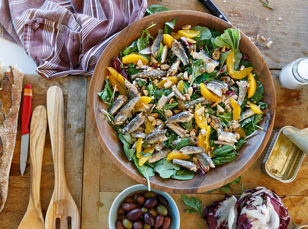 A bowl of anchovy salad with beans