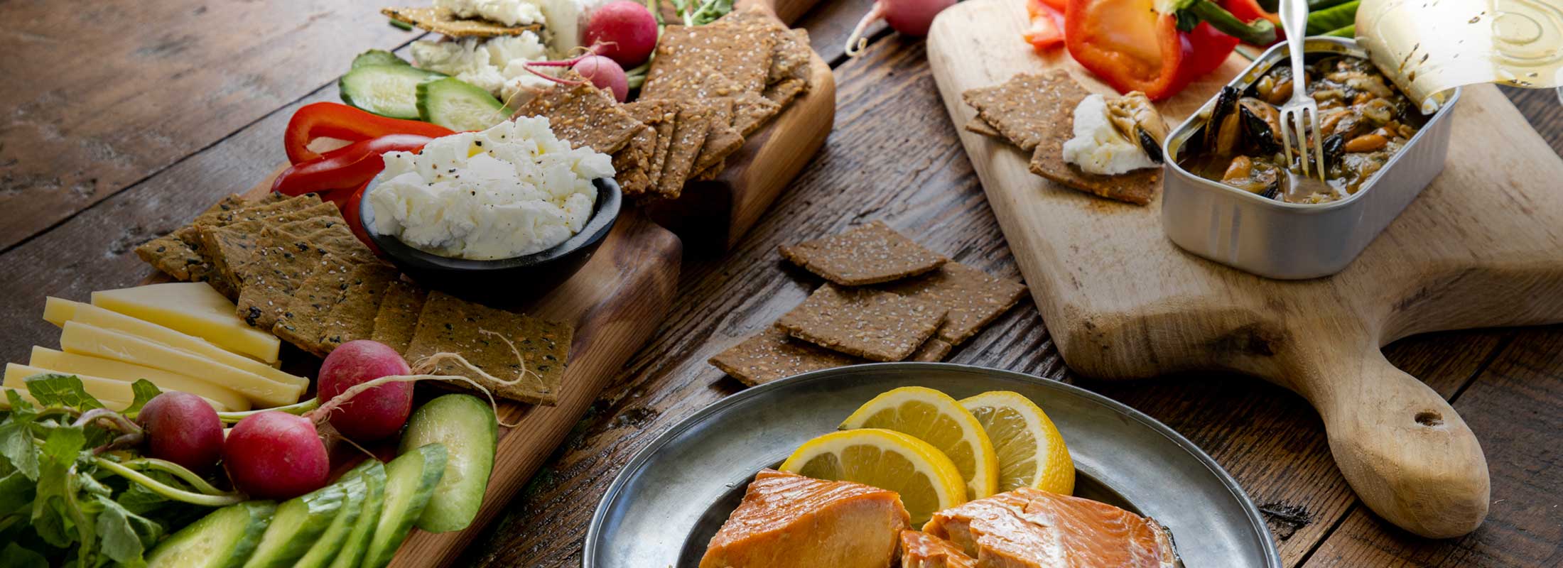 Gluten-free crackers paired with smoked salmon, tinned mussels, fresh crunchy vegetables and creamy cheeses—all gluten free