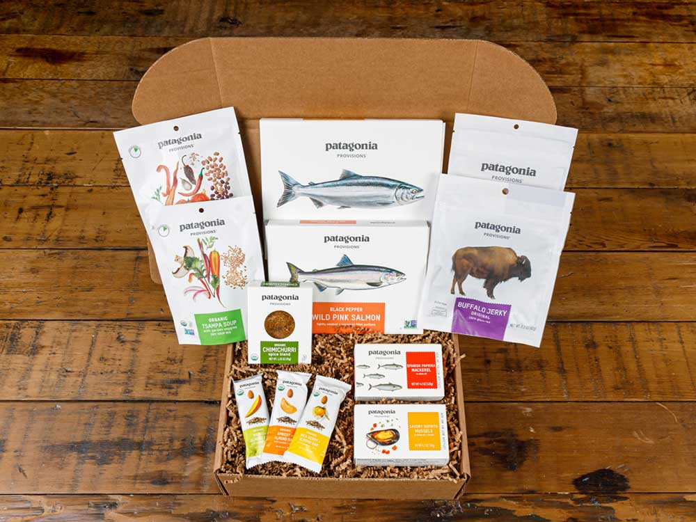 Open gift box filled with Patagonia Provisions shelf stable products