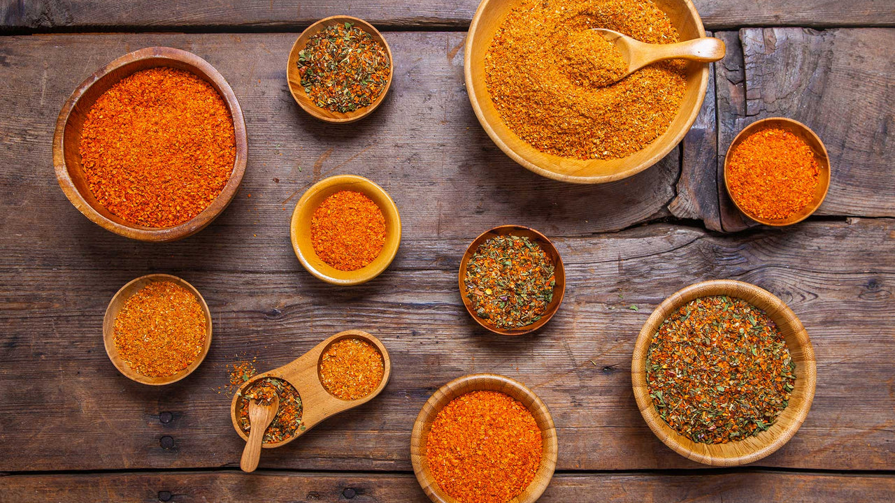 Bowls of Patagonia Provisions Organic Spices on a wooden table