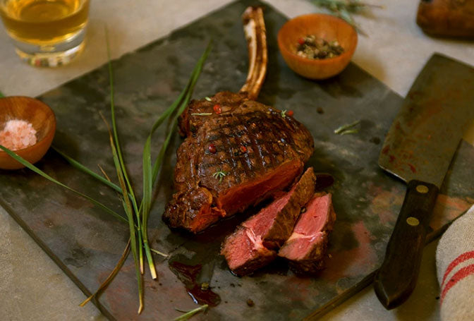 Cooked buffalo steak on a serving board