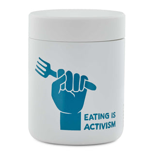 White MiiR Food Canister with blue illustration of fist holding fork beside hand-lettered Eating Is Activism message