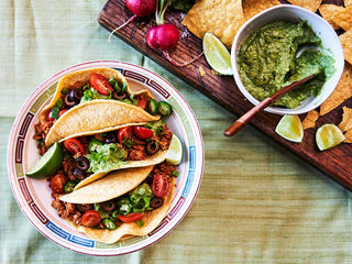 A paste of three soft tacos filled with vegetables, walnuts, and spiced with Patagonia Provisions Taco Seasoning