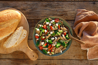 Kernza® Fusilli Pasta Salad on a table with bread