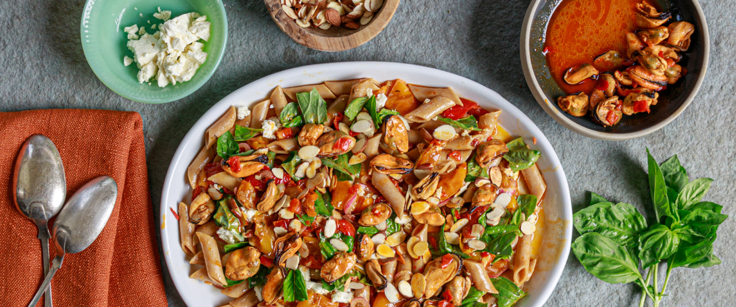 A plate of pasta and spicy mussels