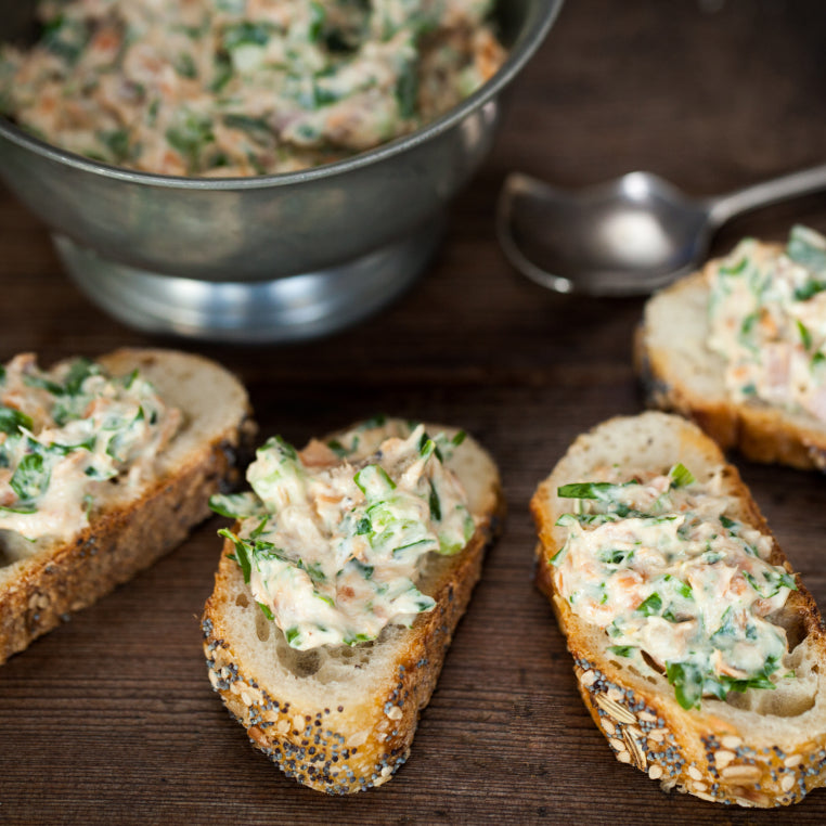Baguette slices topped with Patagonia Provisions wild salmon spread