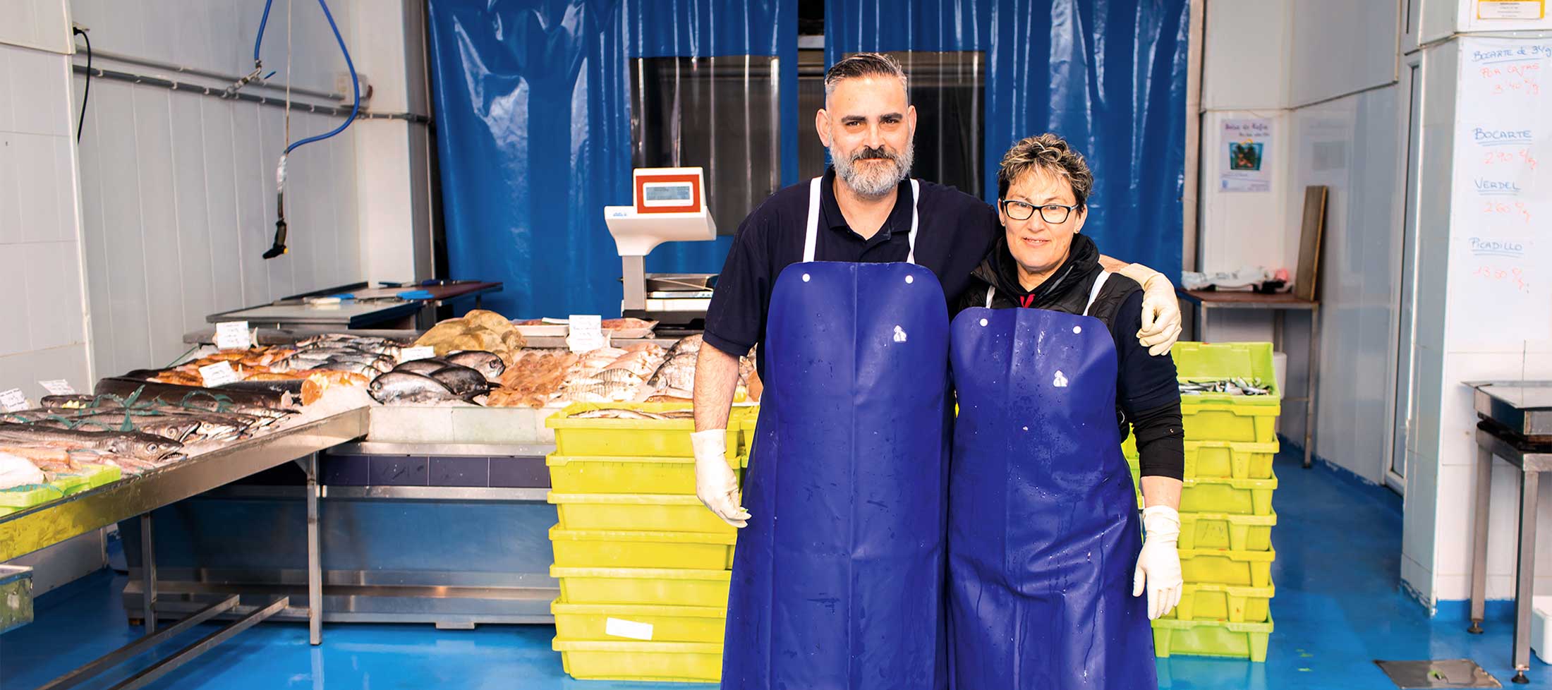 Rafael Ruiz Lanza and Marie Del Pilar Plaza Ruiz after a busy morning rush at Pescados Pali, a Santoña fish market.